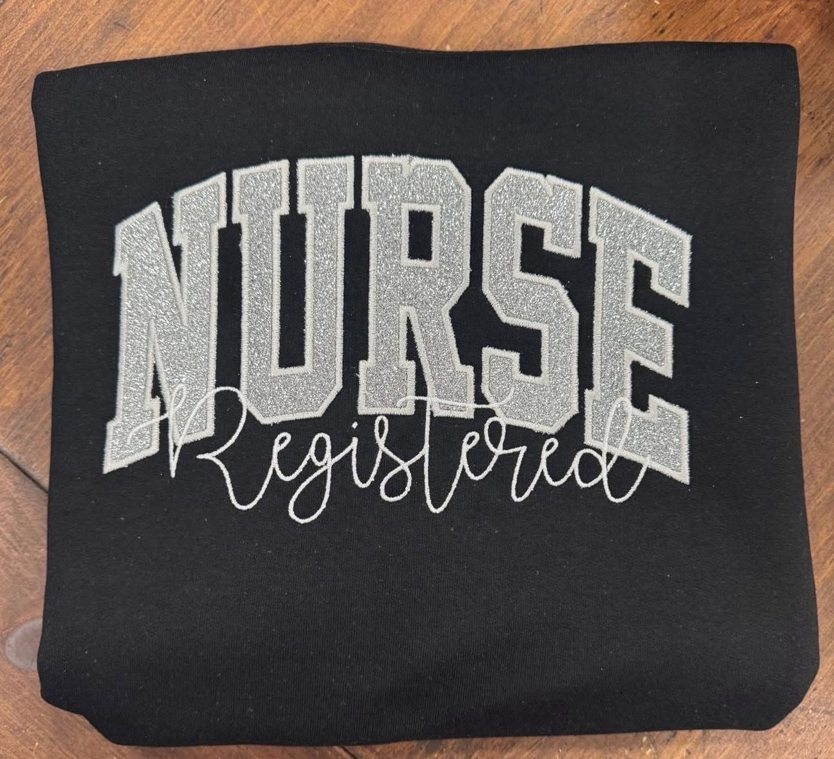 Silver Registered Nurse - Embroidered Black Gildan Sweatshirt